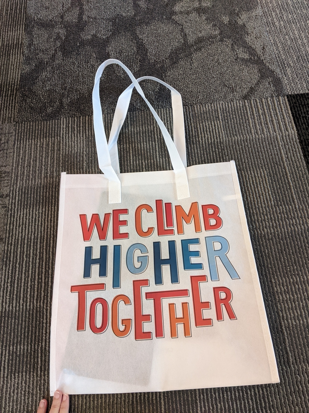 We Climb Higher Together White Tote Bag with Red & Blue Print